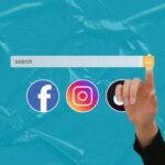 A hand clicking with the index finger a search icon on a search bar. Right under the search bar the logos of Facebook, Instagram and Twitter representing how people now use Social Media as a Search Engine