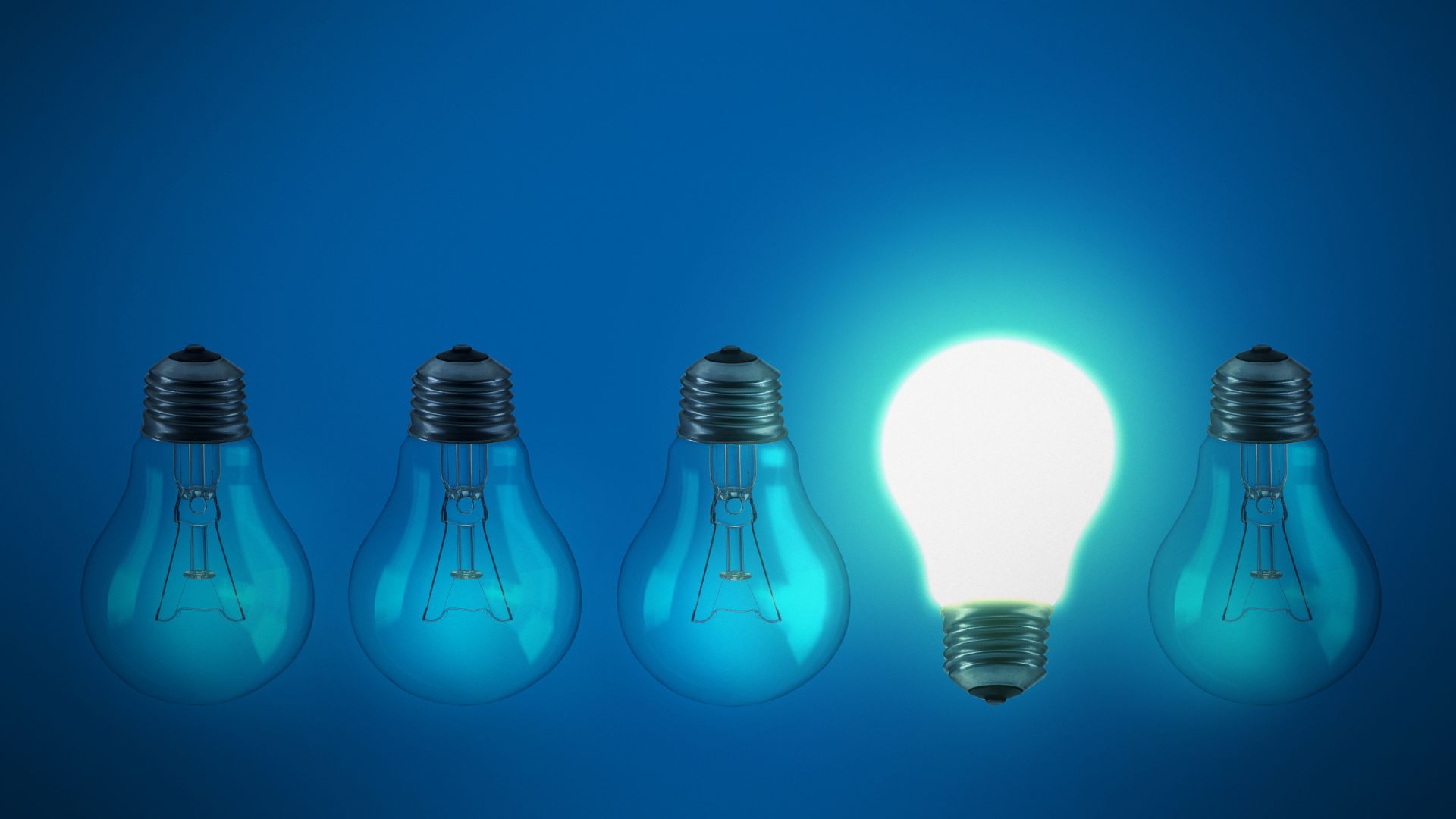 5 lightbulbs on a blue background. 4 of them are facing down and off. One is facing up and on. This is representing how you can get inspo when you run out of ideas.