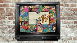 An old TV, showing the MTV Logo along with some colorful doodles that look very 90's as a representation of the impact of MTV on pop culture. The TV has an old brick wall behind it.