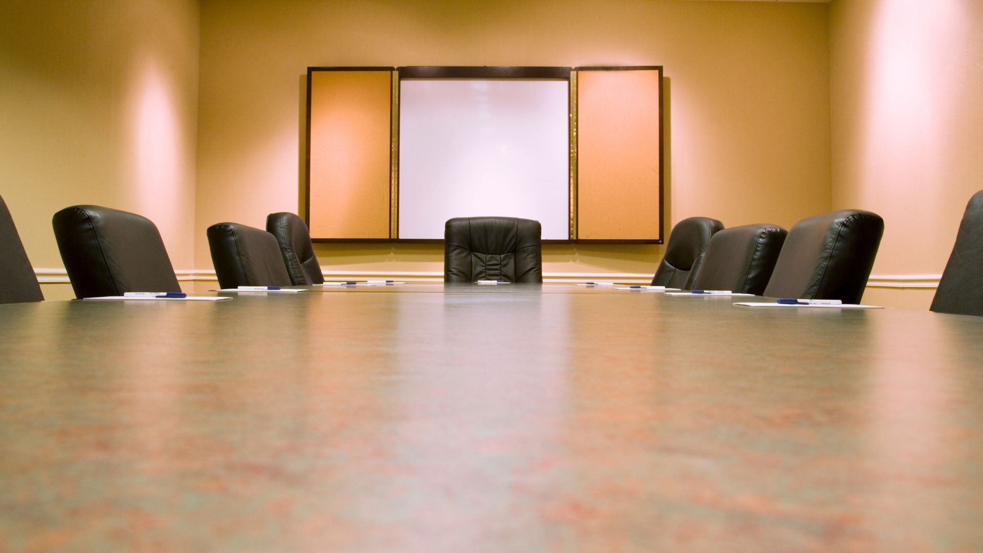 A meeting room. Plain, boring and empty. A representation on how Being Too Corporate on Social Media Might Be Killing Your Brand