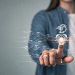 A woman, touching a holographic screen representing someone trying to control the algorithm. The algorithm hates you.